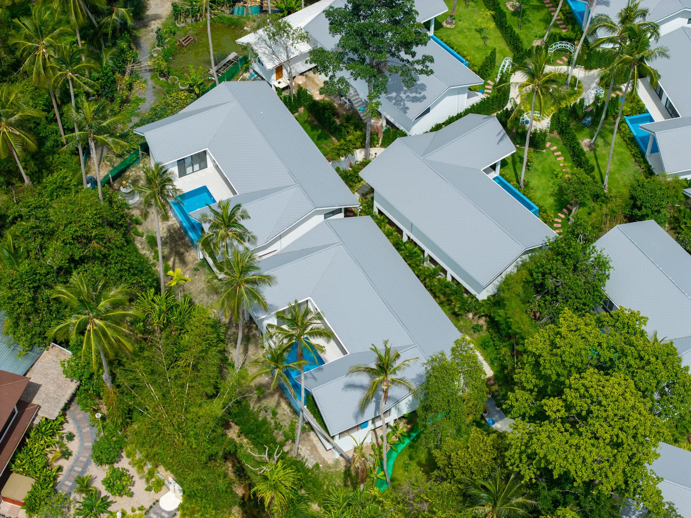 Aerial view of Osho villas among tropical green