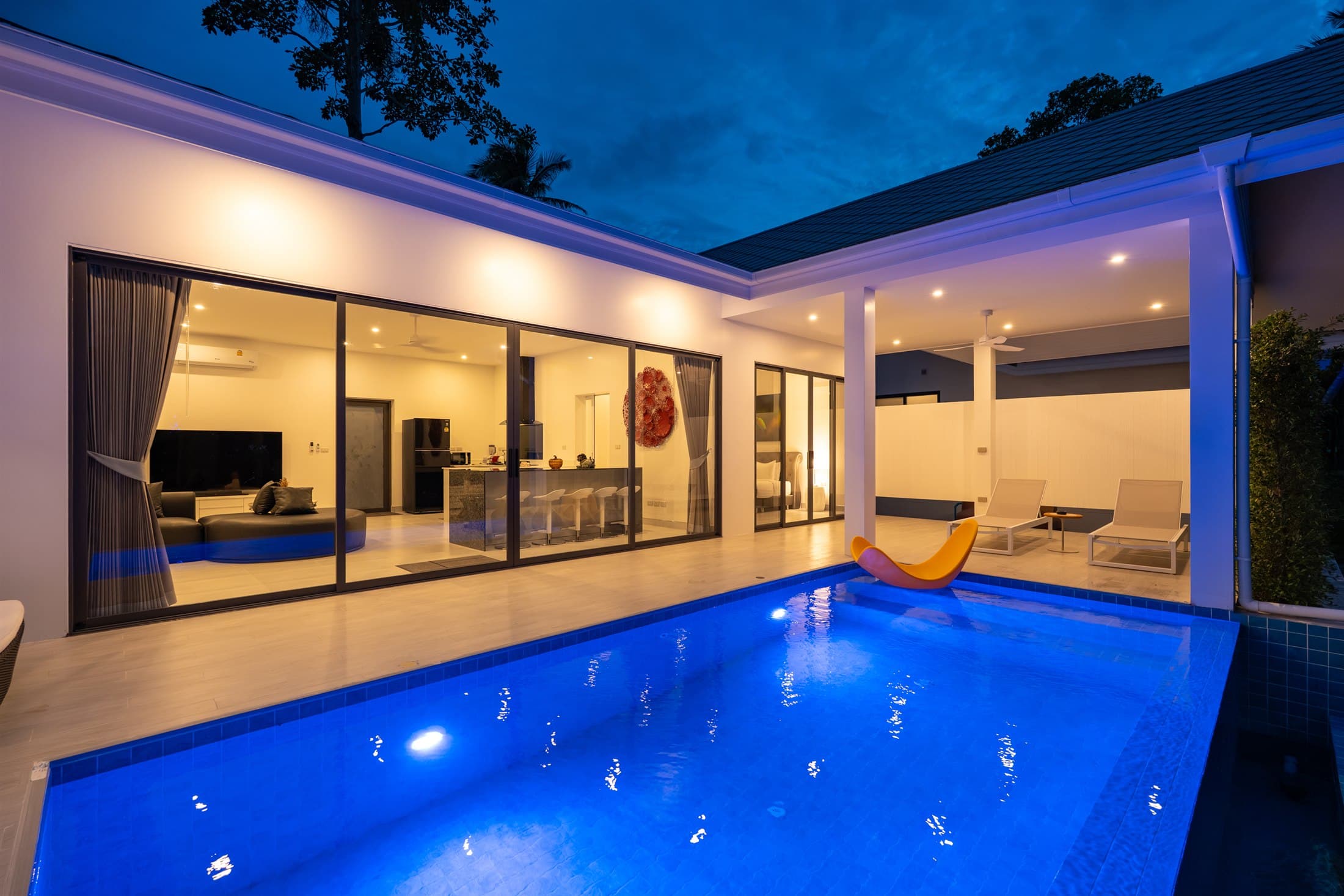 Osho Luxury Villas private pool villa illuminated at dusk